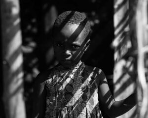 A-black-and-white-portrait-of-a-young-girl-in-RakaiUganda-1
