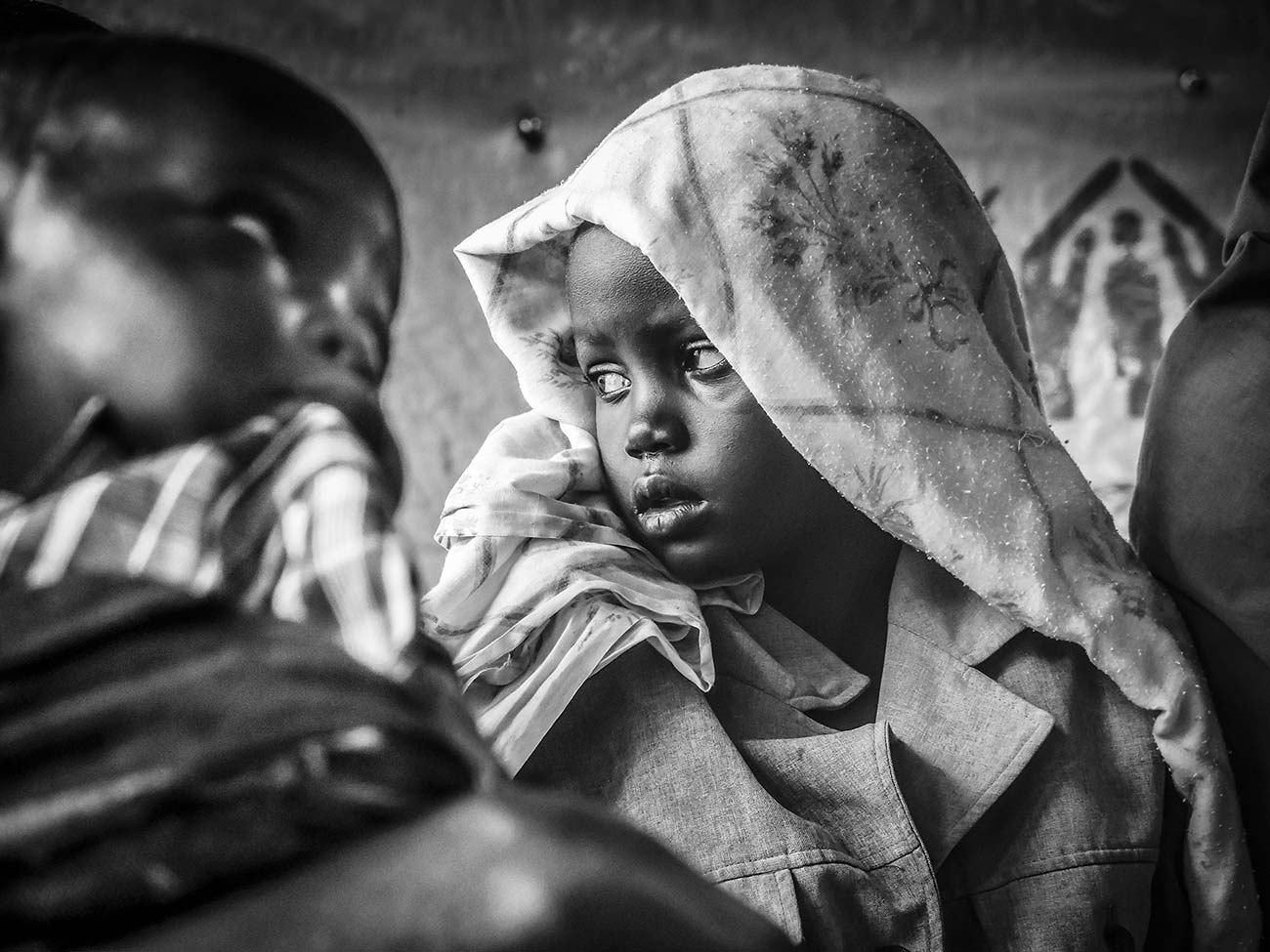 A-sick-girl-waitmedicakl-attention-in-a-health-centre-in-bidibidi-refugee-campUganda-East-africa
