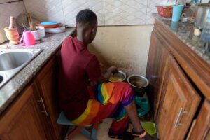 A-transgender-woman-cooks-a-meal-for-colleagues-in-a-transgers_-shelter-in-kasangatiUganda-amidts-stigma-towards-the-LGBTQ-community