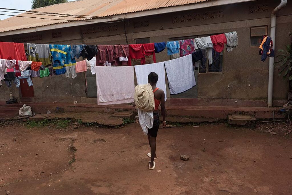 She_he-goes-to-the-wire-to-hung-her-clothes-in-her-new-neighbourhood-in-kampalaUganda