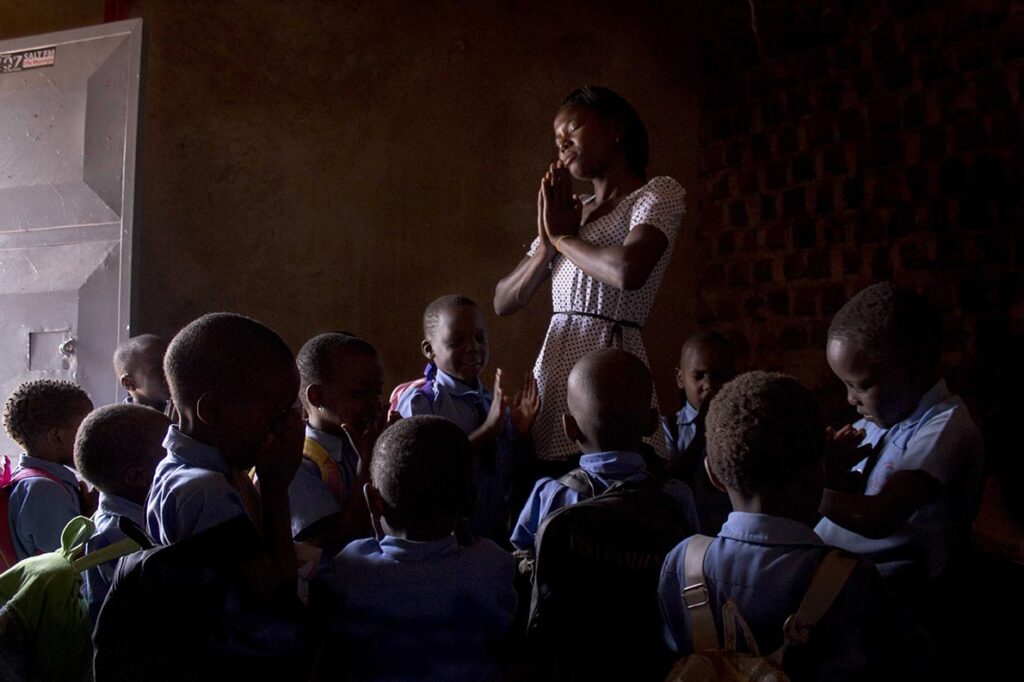 The-morning-prayer-Annet-says-a-prayer-with-her-students-every-morning-before-teachin-in-kalerweUganda